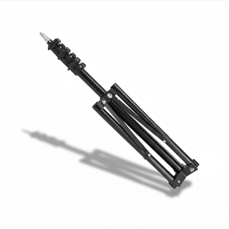 Trépied lumière 200 cm noir plié sur fond blanc