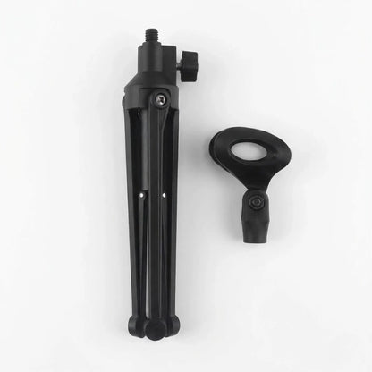 Trépied micro plié et poser sur un fond blanc